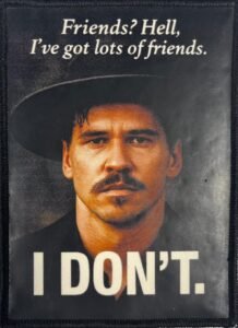 Custom sublimated patch featuring a western-style portrait and quote design