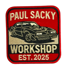 Detailed custom embroidered patch with logo text and vehicle artwork